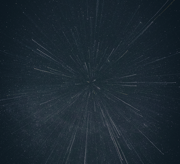 A starfield with bright streaks radiating outward from the center.